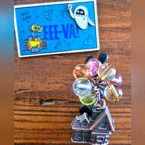 2 Disney pins. UP and WALLE AND EVE.